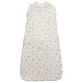 White baby sleeping bag with leaves pattern on a white background