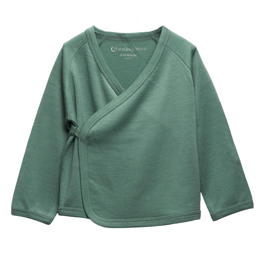 A sage green jersey merino long-sleeve baby kimono wrap top with a V-neck and button closure, laid flat on a white background.