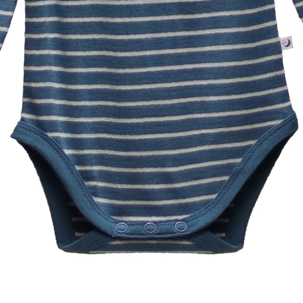 Close up of snaps on blue merino baby bodysuit