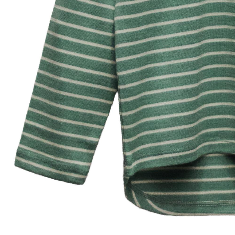 Close-up of a green and white striped merino shirt with a white background