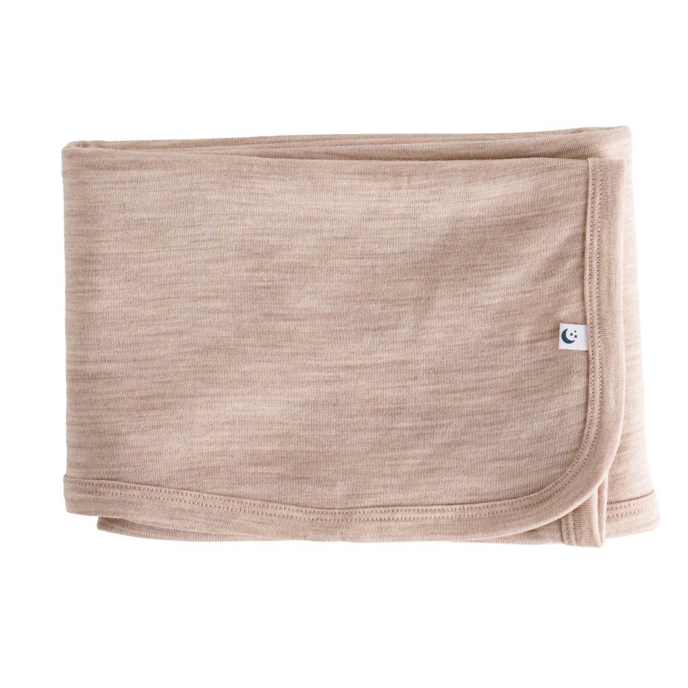 Merino baby blanket with a small logo on a white background