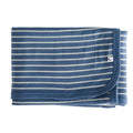 A folded baby blanket made from jersey merino with horizontal blue and off-white stripes, featuring a small white logo tag on the right side, set against a plain white background.