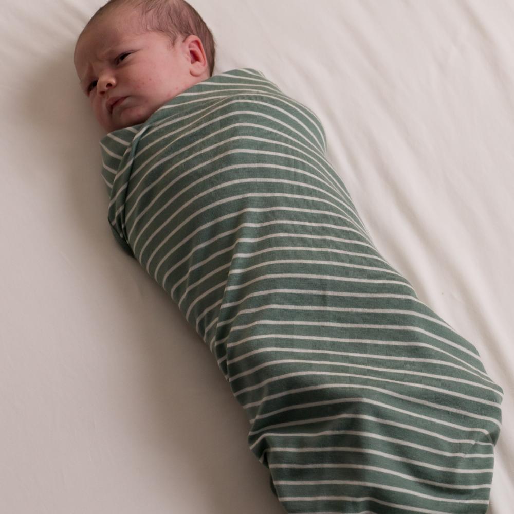 Newborn baby swaddle in merino jersey blanket by the sleep store