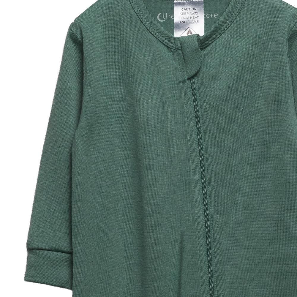 The sleep store green merino baby onesie with a zipper on a white background
