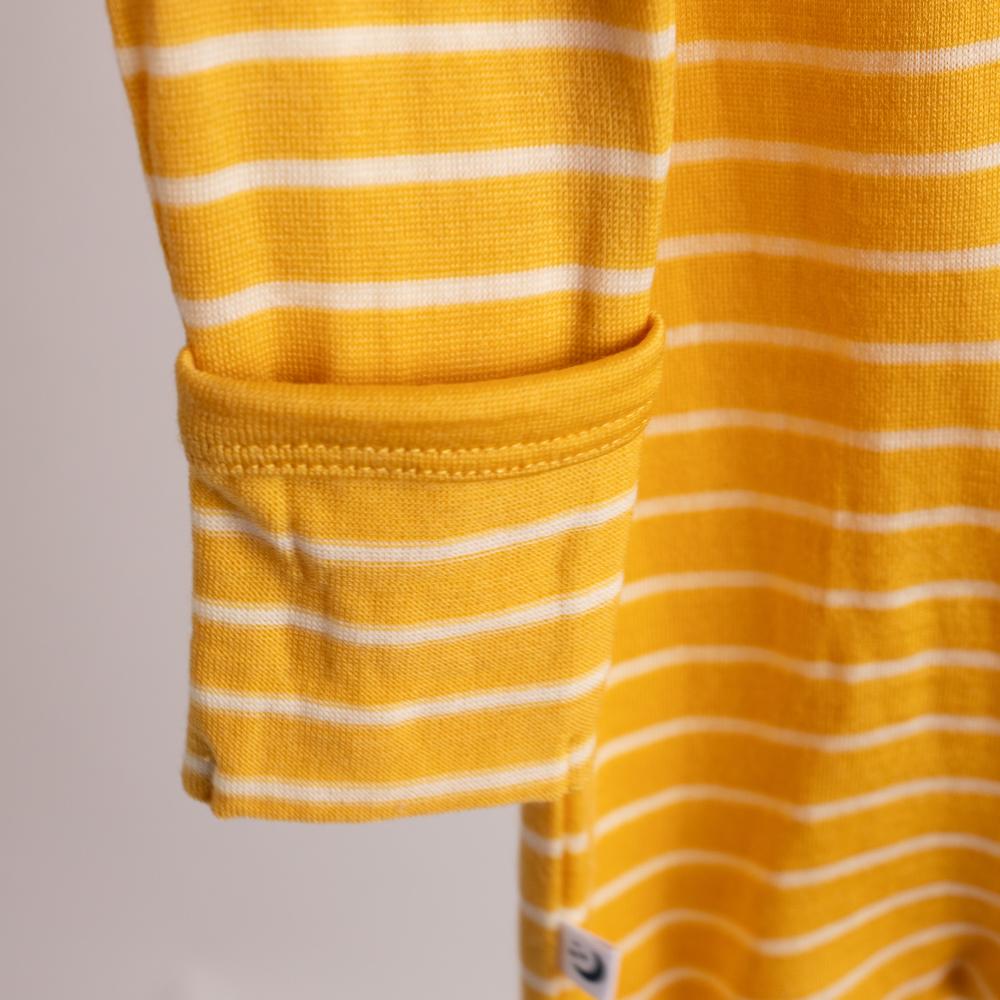 Close up of cuff on yellow striped merino onesie