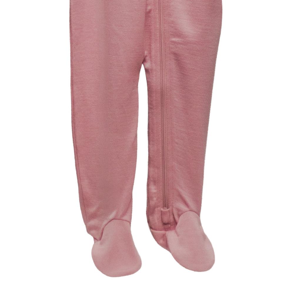 Merino pink baby onesie with footies on a white background