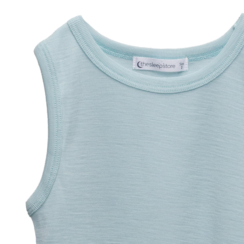 Light blue merino sleeveless singlet top with 'thesleepstore' label on a white background