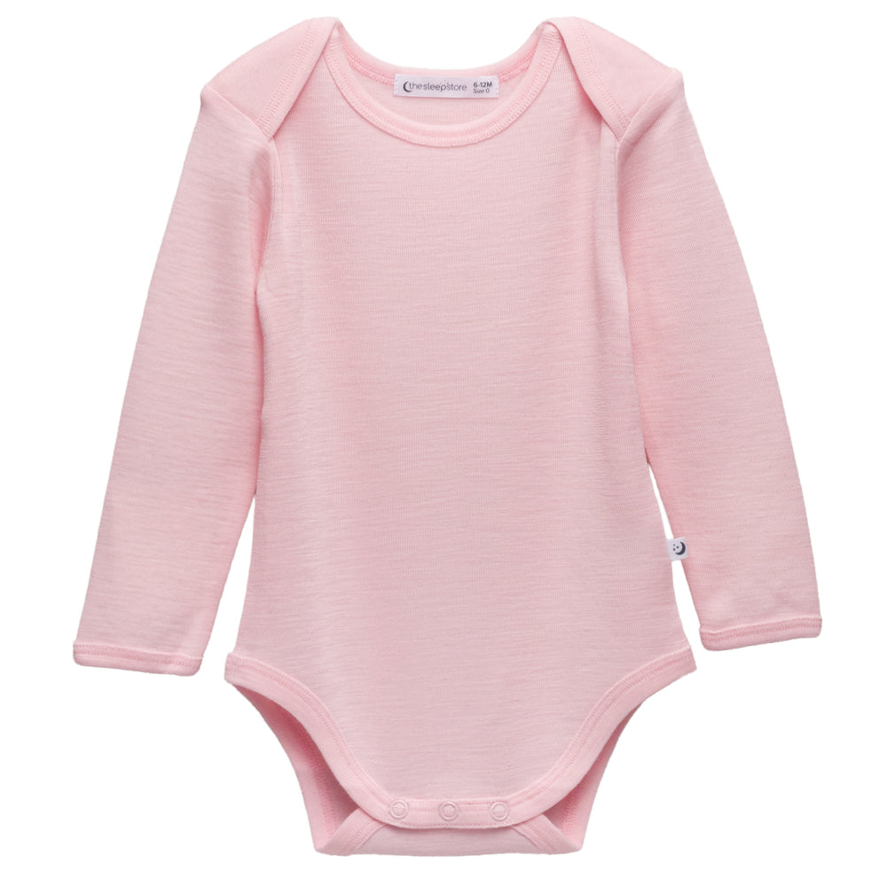 Soft pink deluxe merino rib baby bodysuit with long sleeves on a white background