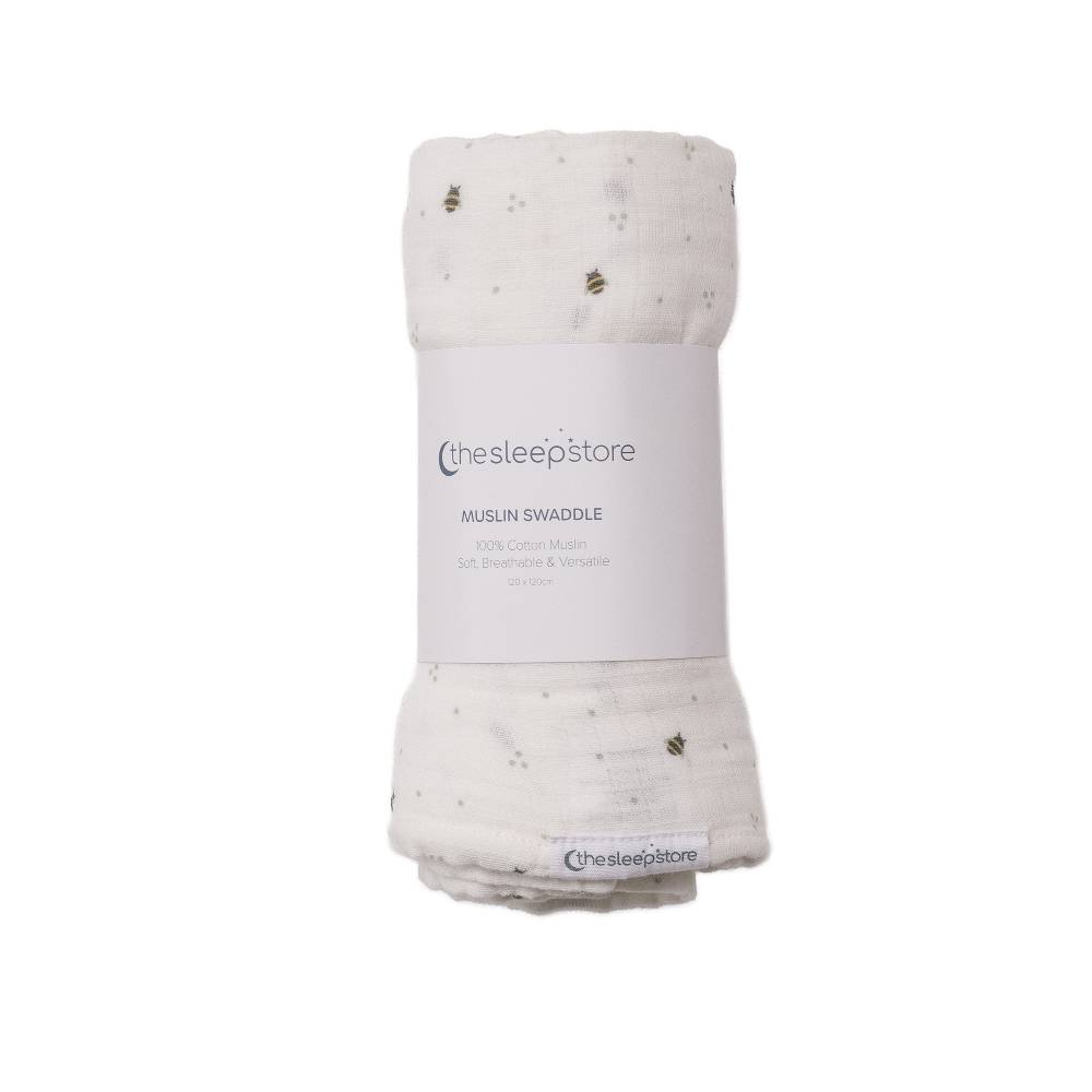 Folded cotton muslin swaddle with 'thesleepstore' label on a white background