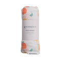 Muslin swaddle with colorful patterns on a white background