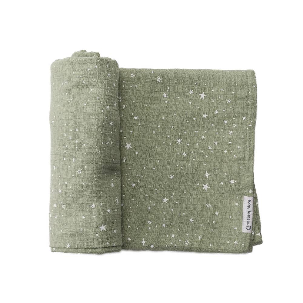 Green baby muslin swaddling blanket with star pattern on a white background