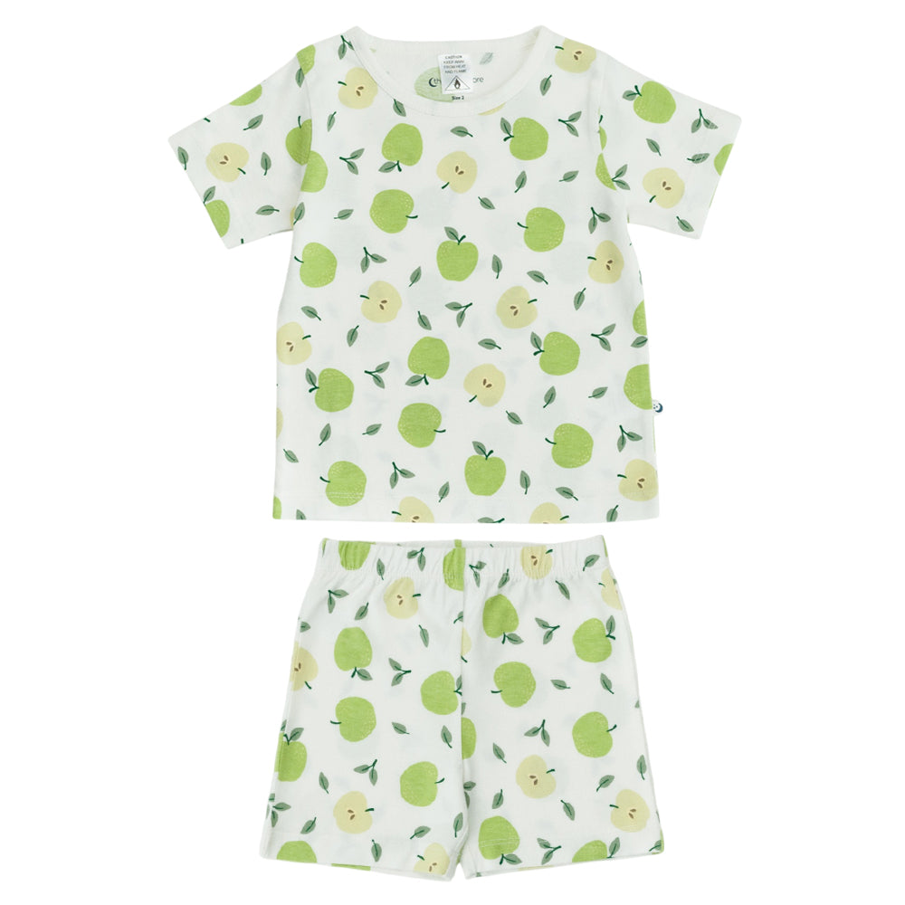 Kids cotton short sleeve PJs with an all over apple print on a white background. 