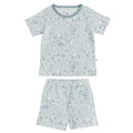 Kids short sleeve pjs with a blue woodlands theme print on a white background. 