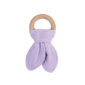 Purple muslin baby teether with wooden ring on a white background