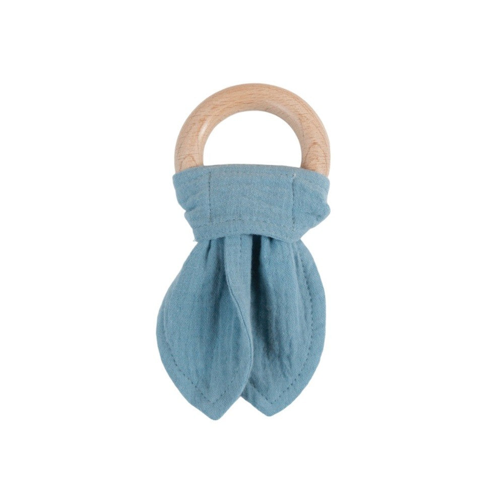 Teething ring with blue cotton muslin fabric and wooden handle on a white background