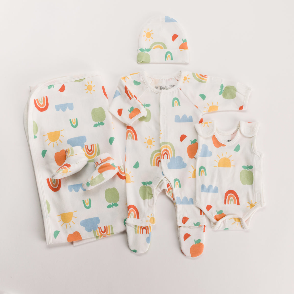 Rainbow gift pack with onesie, singletsuit booties, beanie and swaddle on white background