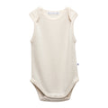 An off-white sleeveless deluxe merino  baby singletsuit with a crew neck and snap closures at the crotch, shown against a plain white background.
