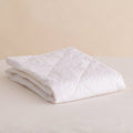 Wool topper folded on a white background