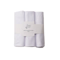 Three white large change pad liners with a label on a white background
