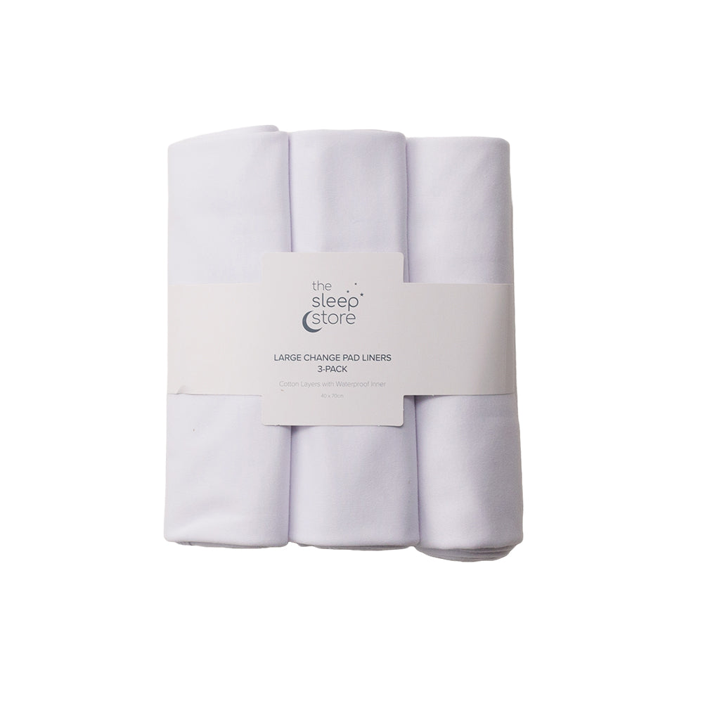 Three white large change pad liners with a label on a white background