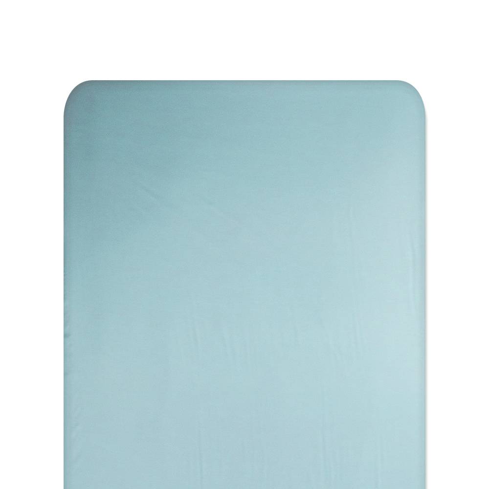Solid light blue fitted silk sheet on a white background