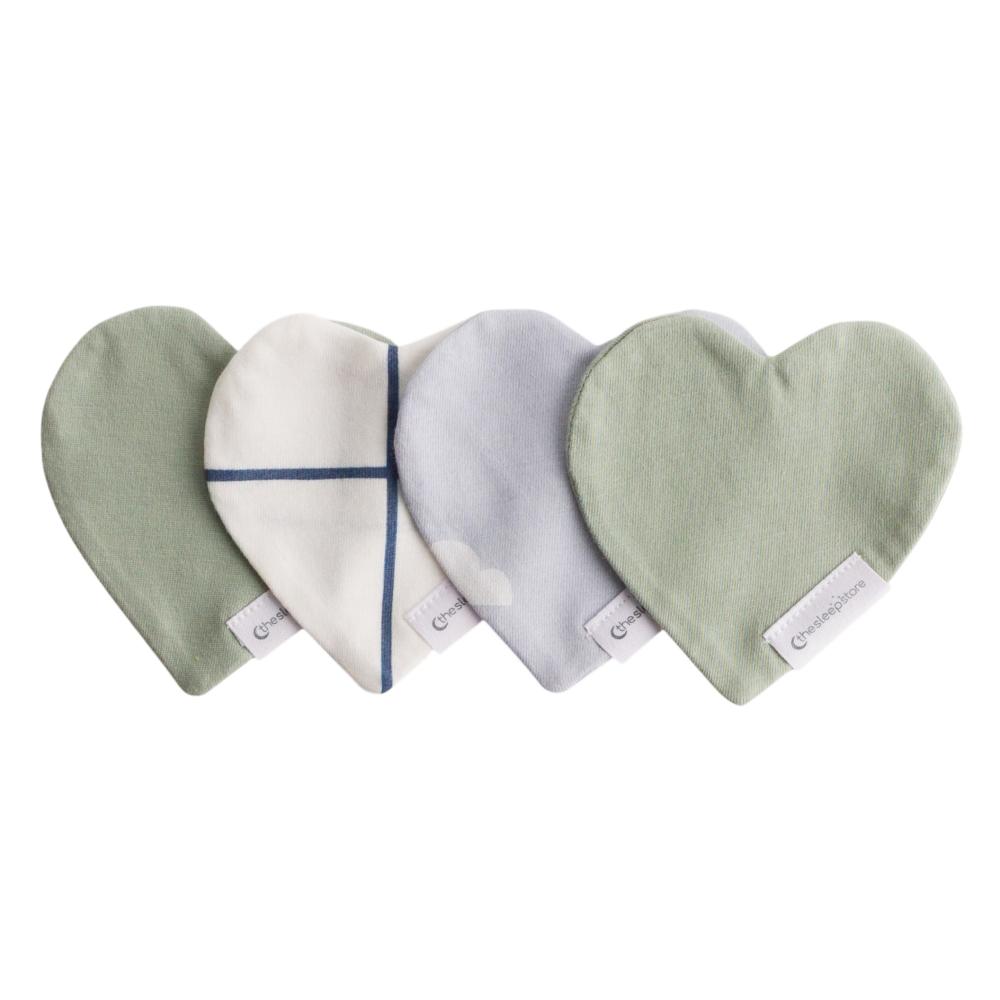 Four heart-shaped comforters in green, white, and gray on a white background