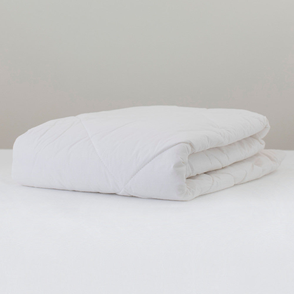 Wool duvet inner folded on a white background