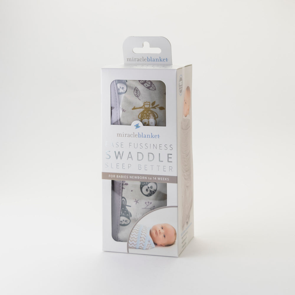 Package of grey owl pattern Miracle Blanket swaddle blanket on a white background