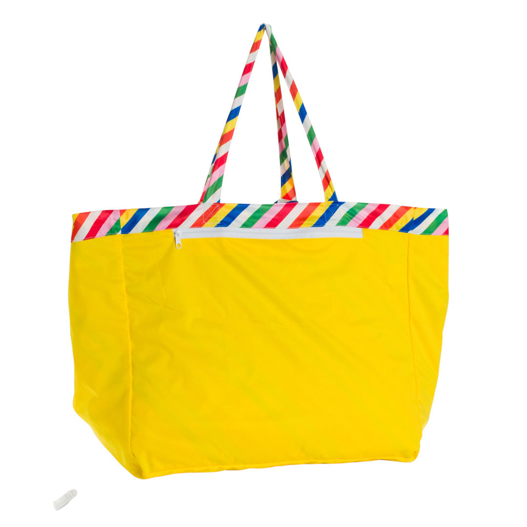 Yellow Nestling tote style beach bag with colorful striped handles on a white background
