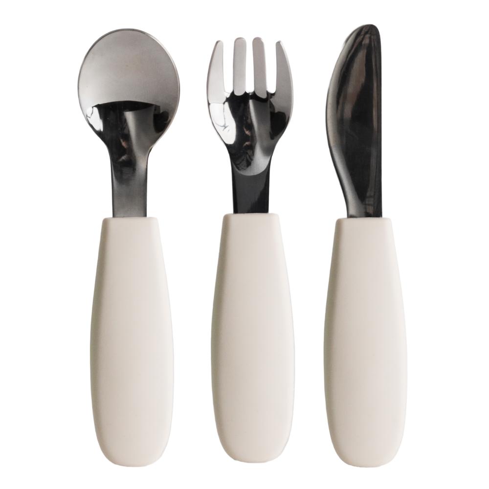 Set of Nestling stainless steel cutlery with oat silicone handles on a white background