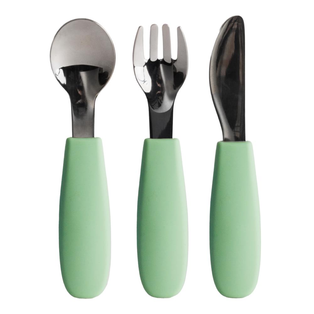 Set of three utensils, spoon, fork and knife with green handles on a white background
