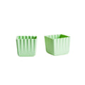 2 green Silicone cups on a white background