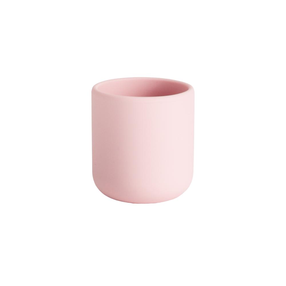 Pink silicone open rim training cup on a white background