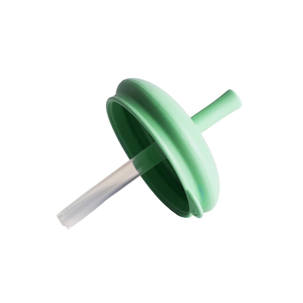 Sage green silicone lid and straw on a white background. 