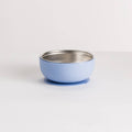 Nestling stainless steel and silicone dusty blue bowl with a metal interior on a white background