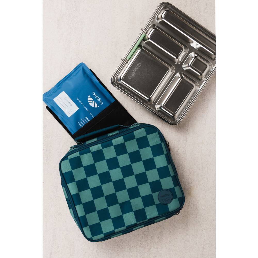 A teal and dark green checkered lunch bag shown alongside a blue ice pack and a stainless steel bento box.