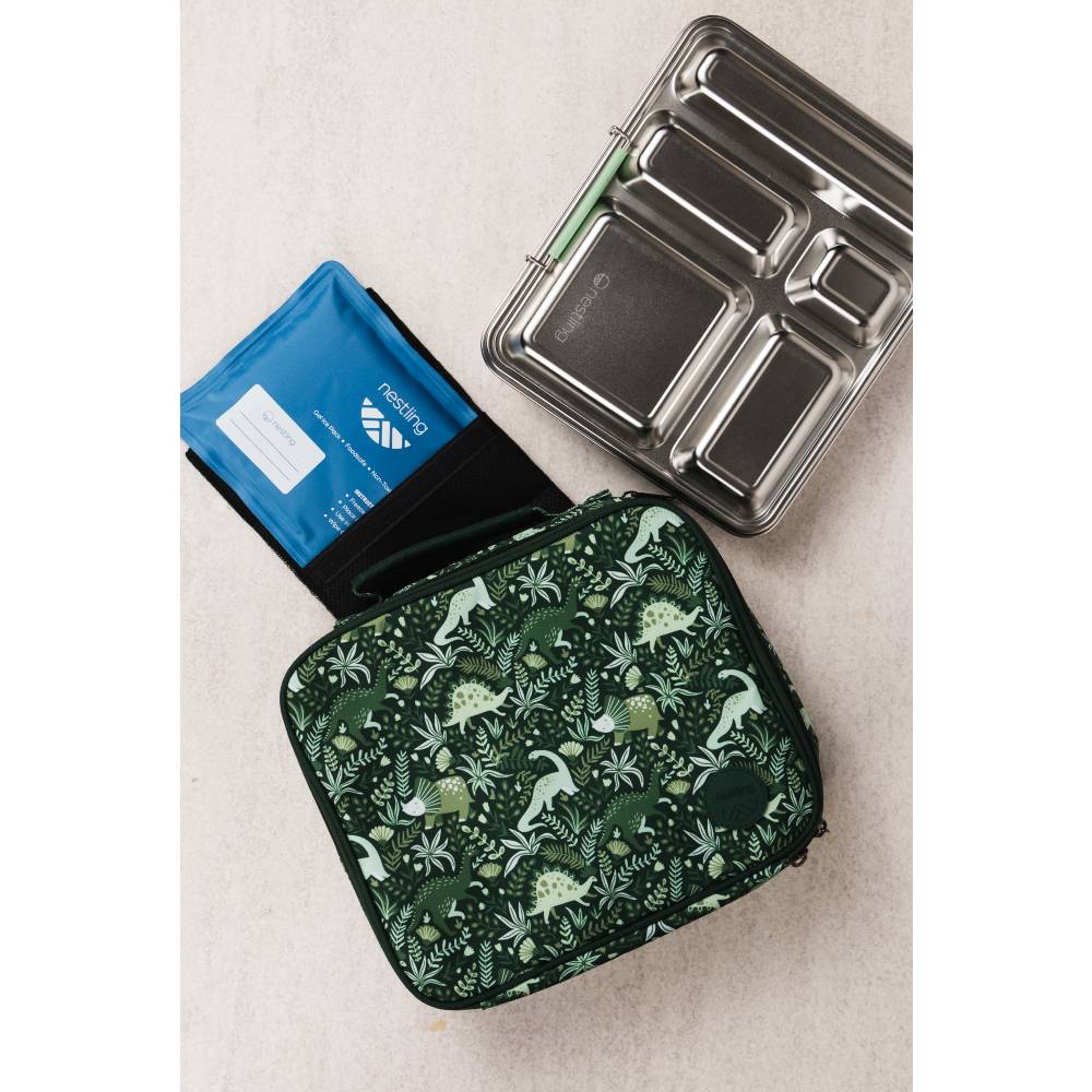 A patterned lunch bag with a dinosaur and plant print in dark green and light green, alongside a blue ice pack and a stainless steel bento box.