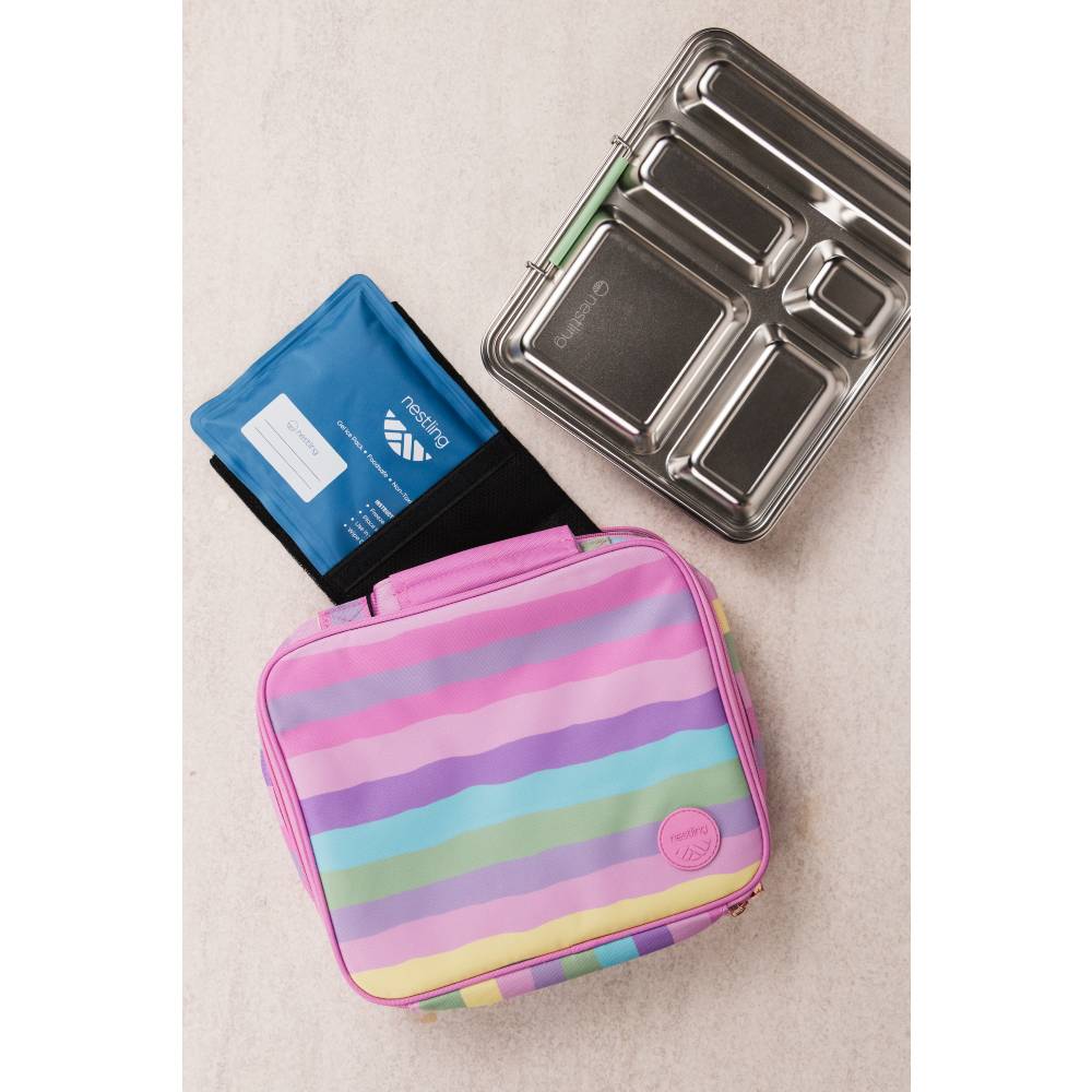 A pastel rainbow striped lunch bag with pink trim, alongside a blue ice pack and a stainless steel bento box.
