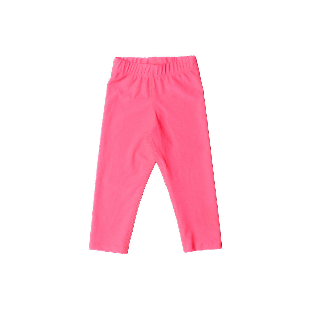 Neon pink swim leggings on a white background