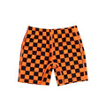Neon orange and black checkered swim shorts on a white background