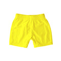 Neon yellow swim shorts on a white background