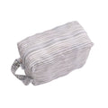 Striped travel packing pod on a white background