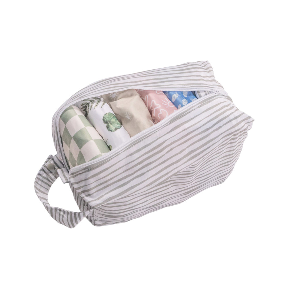 Striped nappy pod bag with baby items inside on a white background