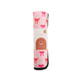 Pink Nestling out & about change mat in a bow pattern on a white background