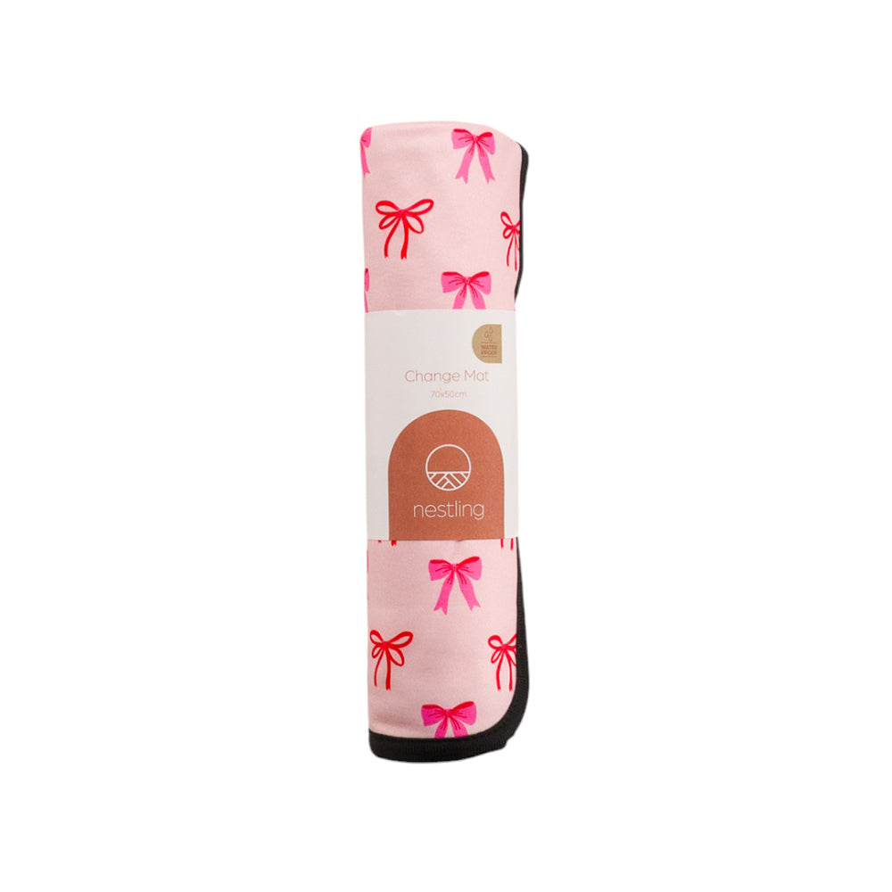 Pink Nestling out & about change mat in a bow pattern on a white background