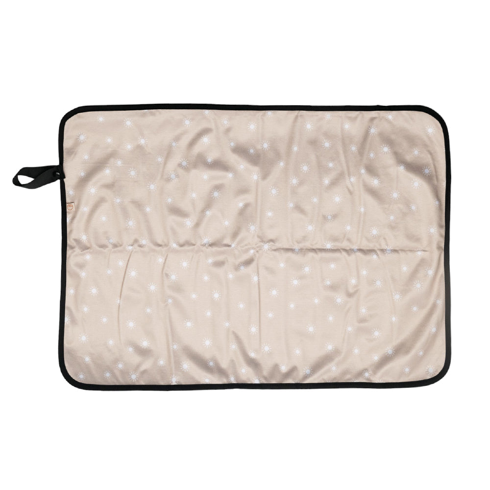 Beige waterproof portable change mat with white sunshine print on a white background