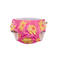 Pink reusable swim nappy with yellow floral patterns on a white background