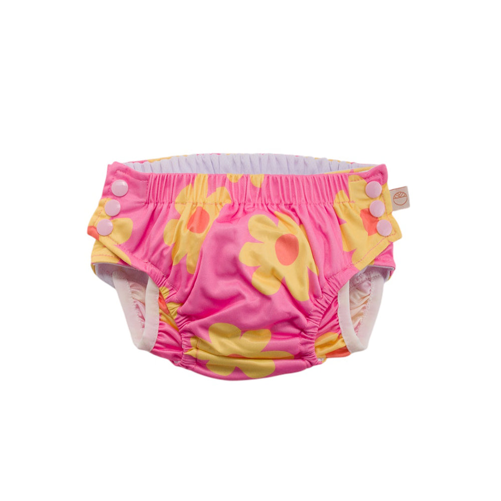 Pink reusable swim nappy with yellow floral patterns on a white background