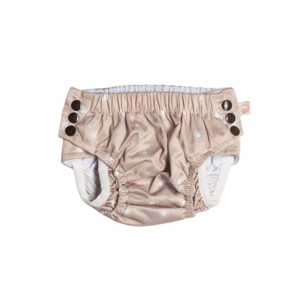 Oat sunshine baby swim nappy with snaps on a white background