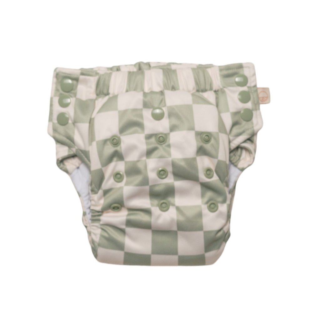 Baby nappy with green check pattern on a white background